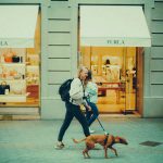 Woman Walking a Dog in City